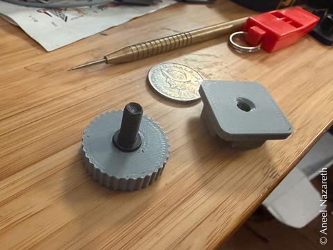 The bottom part is more visible with the two pieces separate. It is knurled and has an M5 screw sticking up out of it